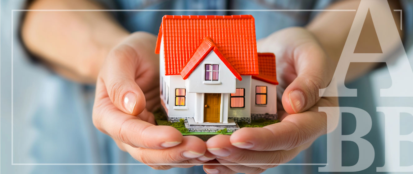 a tiny house in hands