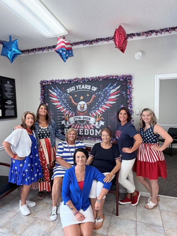 Loris Main Street employees dressed in patriotic workwear to celebrate America's 250th birthday
